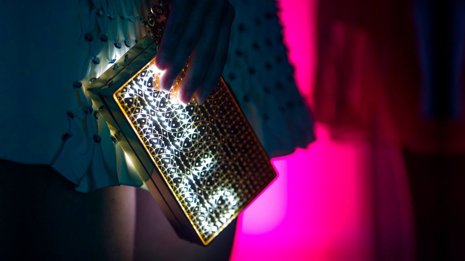 The Mirror Handbag is made out of ultra-lightweight aerospace aluminum and a laser-etched acrylic mirror that lets the light from the LEDs shine through. The app-controlled LEDs create animations and display messages and tweets. The expressive accessory is available in black or gold, with color or white LEDs, and with or without Swarovski crystal sides.