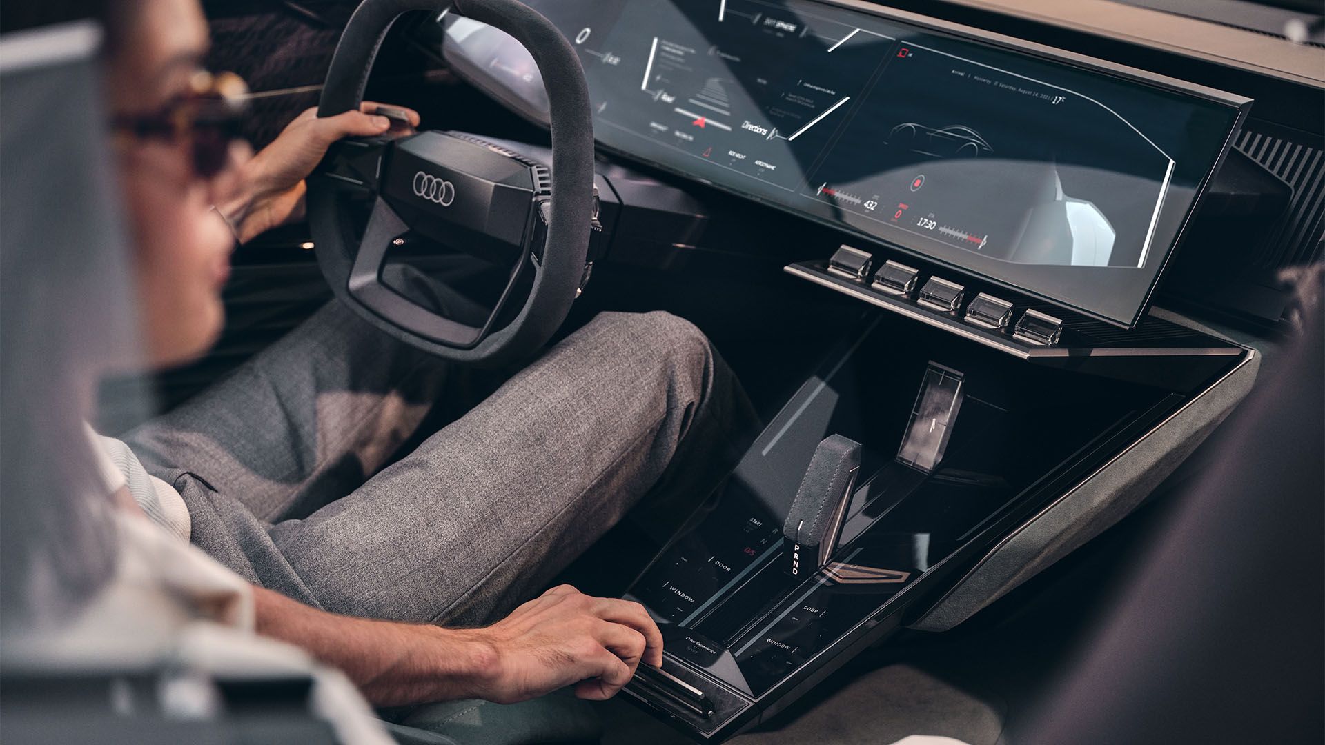 Driver and passenger in the Audi skysphere concept in “Sports” mode.
