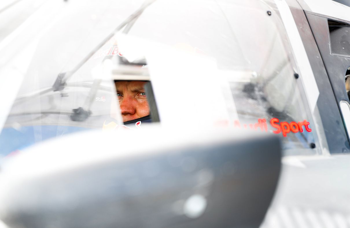 Close-up of Mattias Ekström’s face as he sits behind the wheel of his rally car.