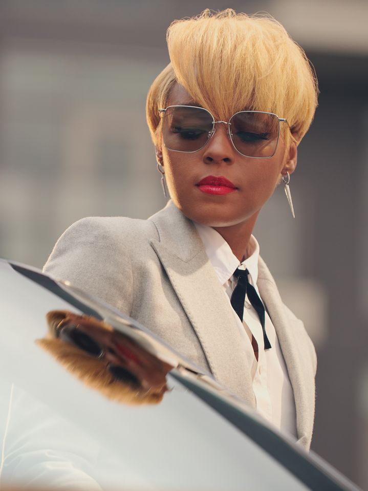 Close-up of Janelle Monáe looking at the windshield of the Audi.