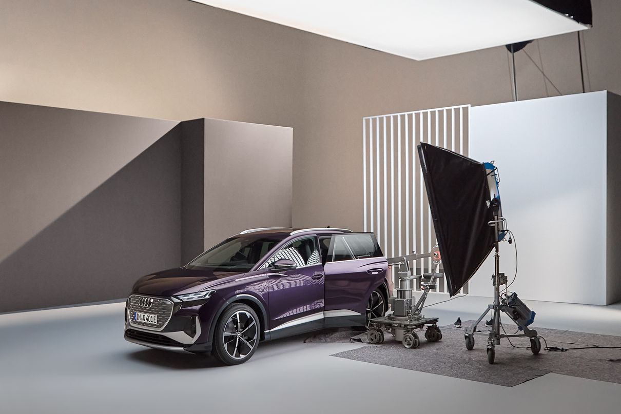 The Audi Q4 e-tron with a plethora of spotlights and cameras in the studio.