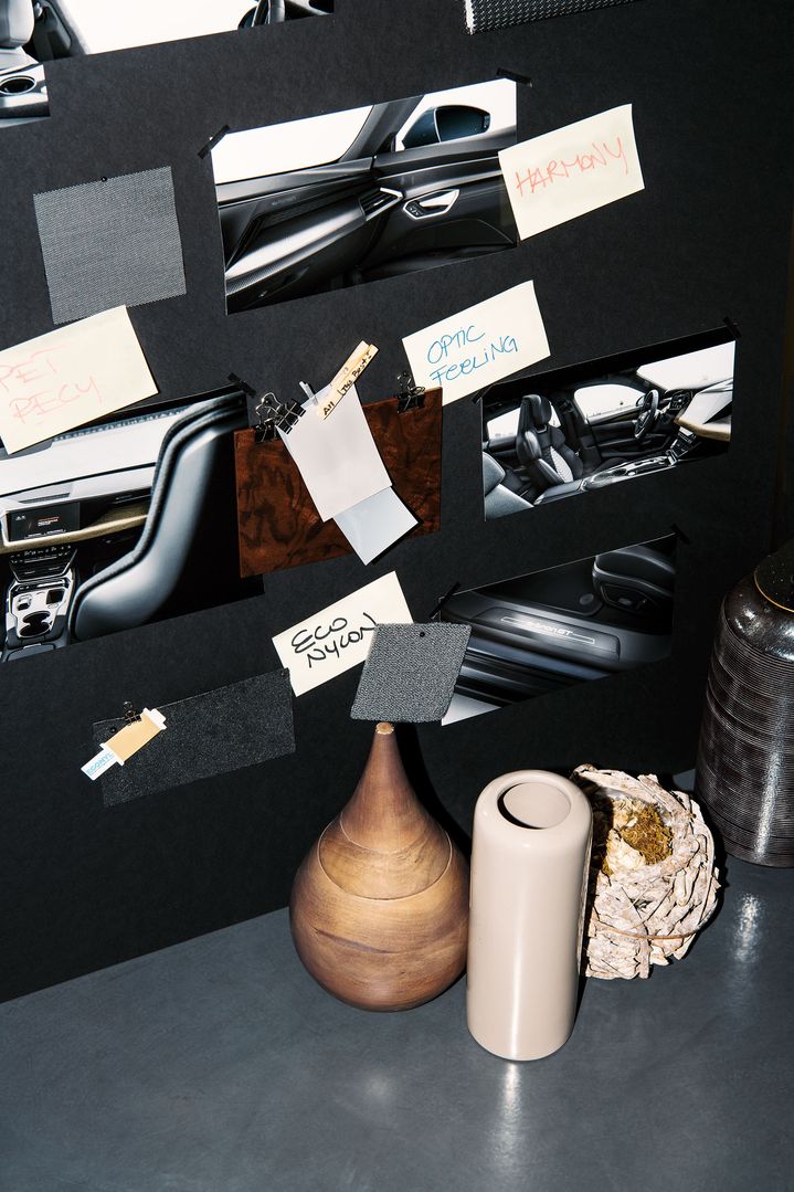 A mood board with shots of a car interior, keywords and objects in natural colours and materials. 