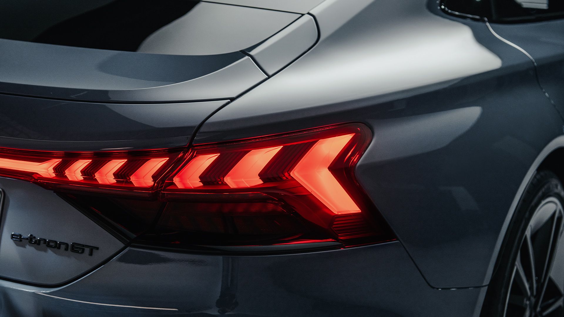 The rear view of the Audi RS e-tron GT highlights its taillights.