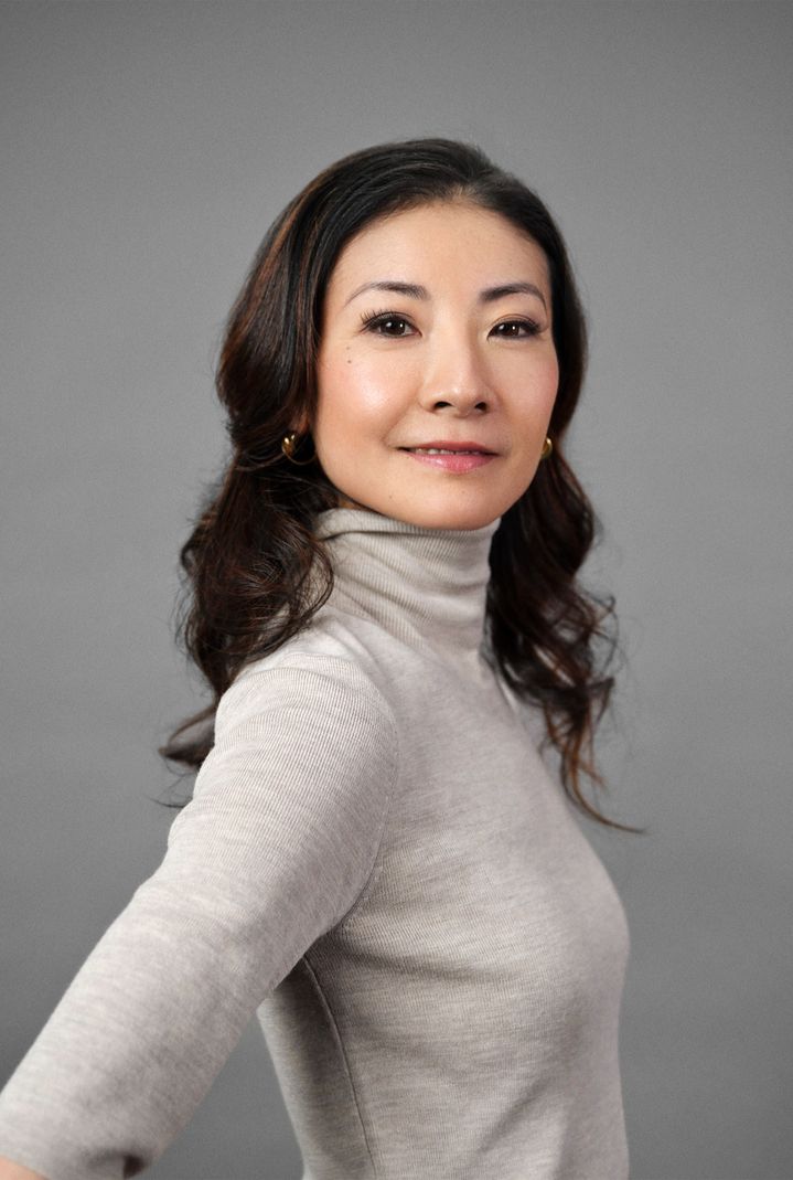 A close-up of Yuan Yuan Tan in a beige turtleneck pullover.