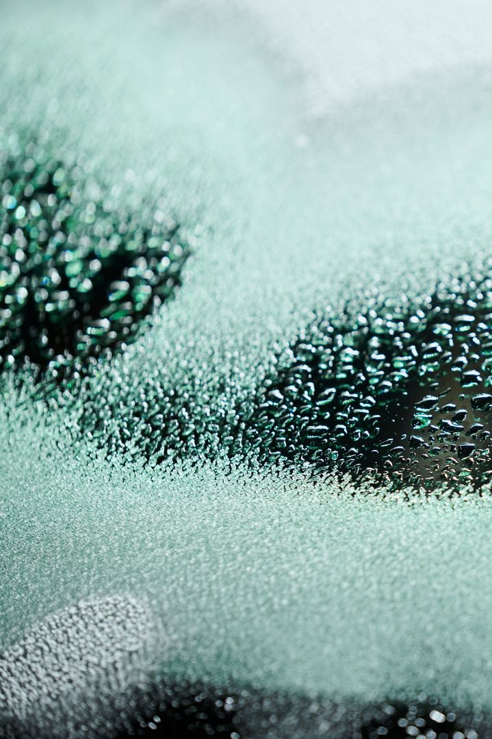 A detailed image of a windscreen defrosting.
