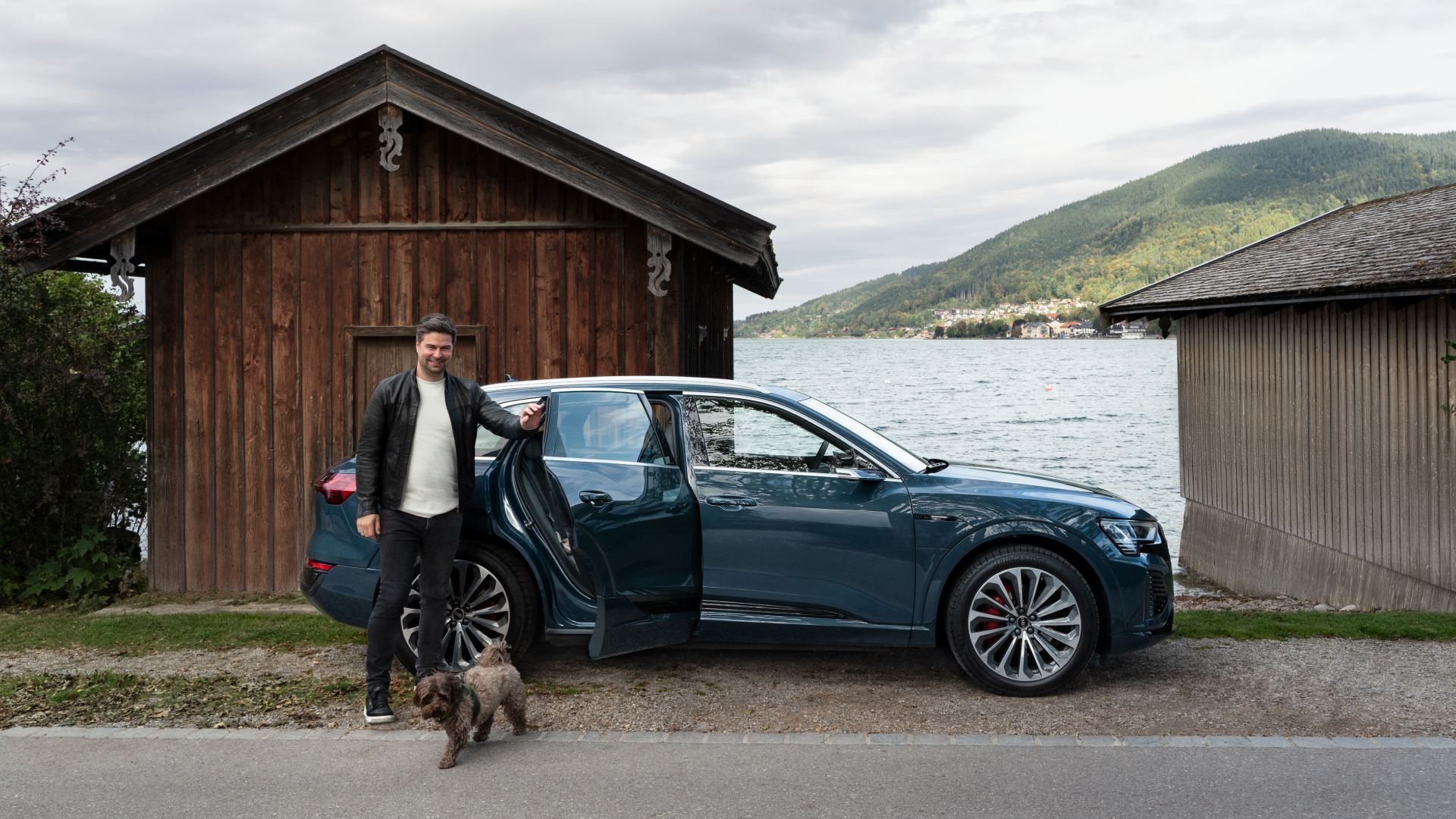 Nils Wollny getting out of the Audi with his dog.